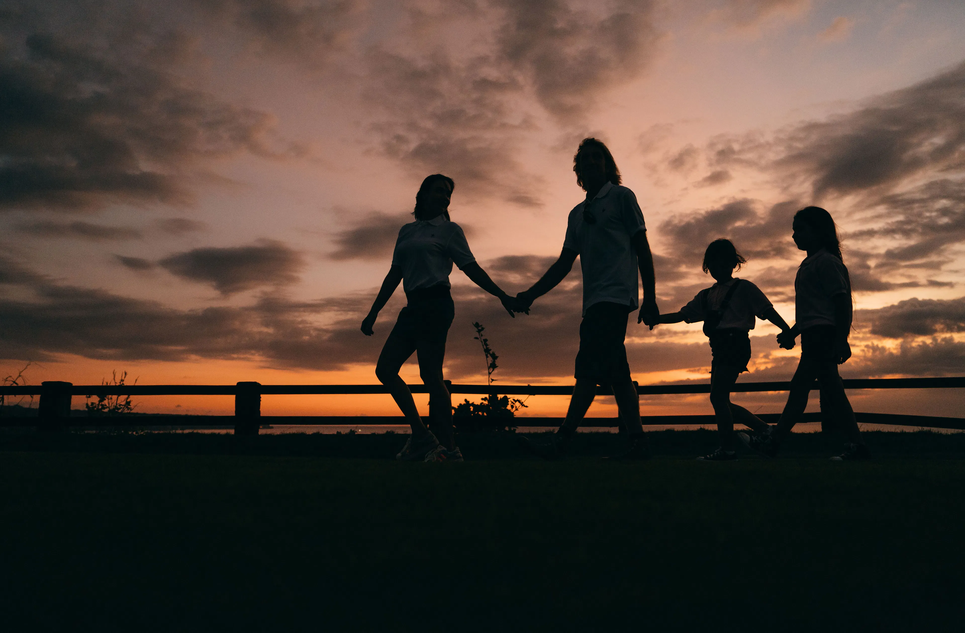 silhouette in the sun with family