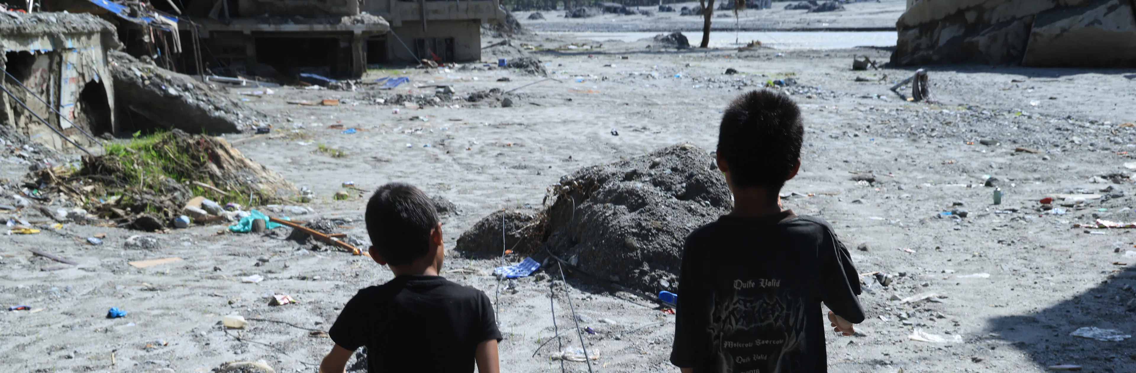 On 9 September 2026, children walk through the site of their school in Nuwakot District, Bagmati Province