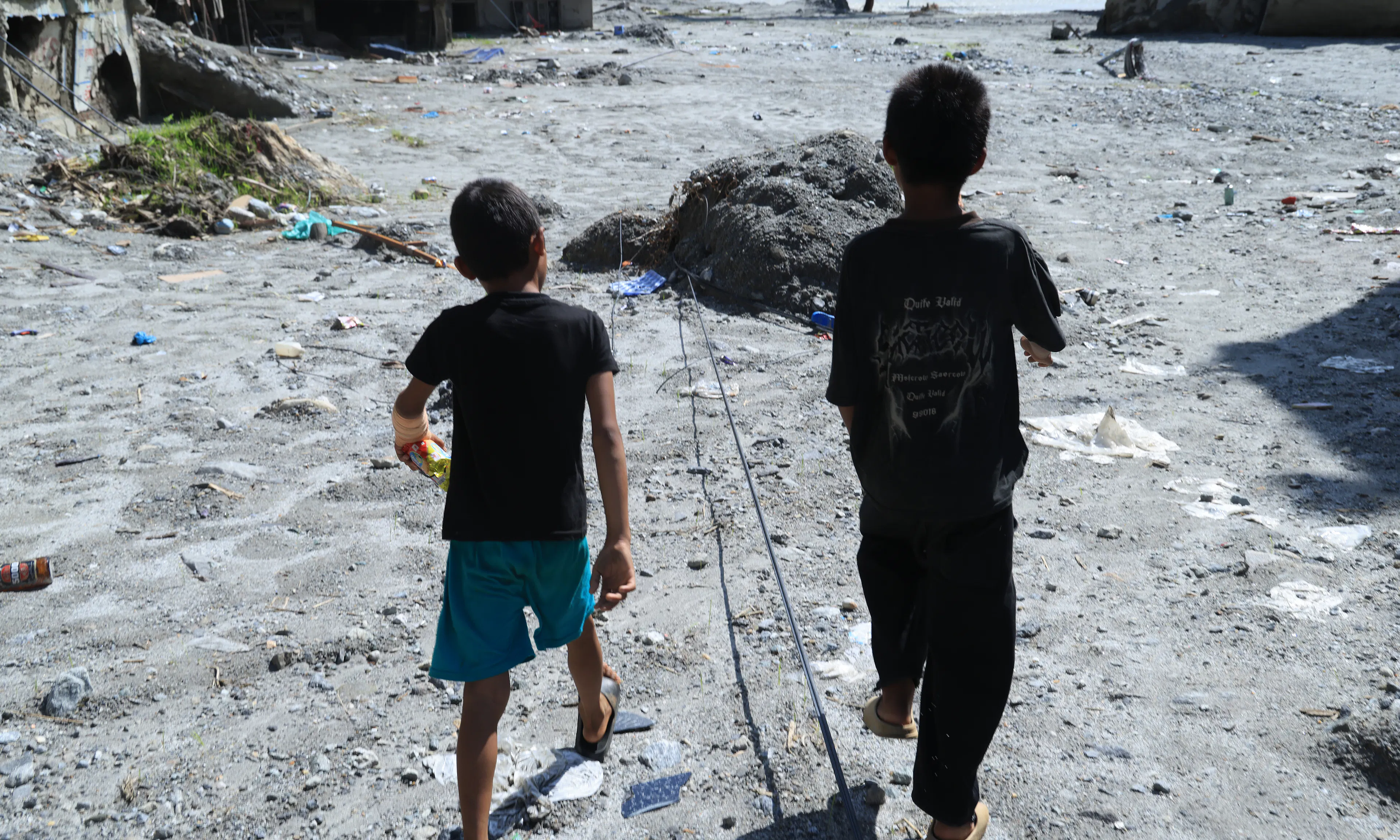 On 9 September 2026, children walk through the site of their school in Nuwakot District, Bagmati Province