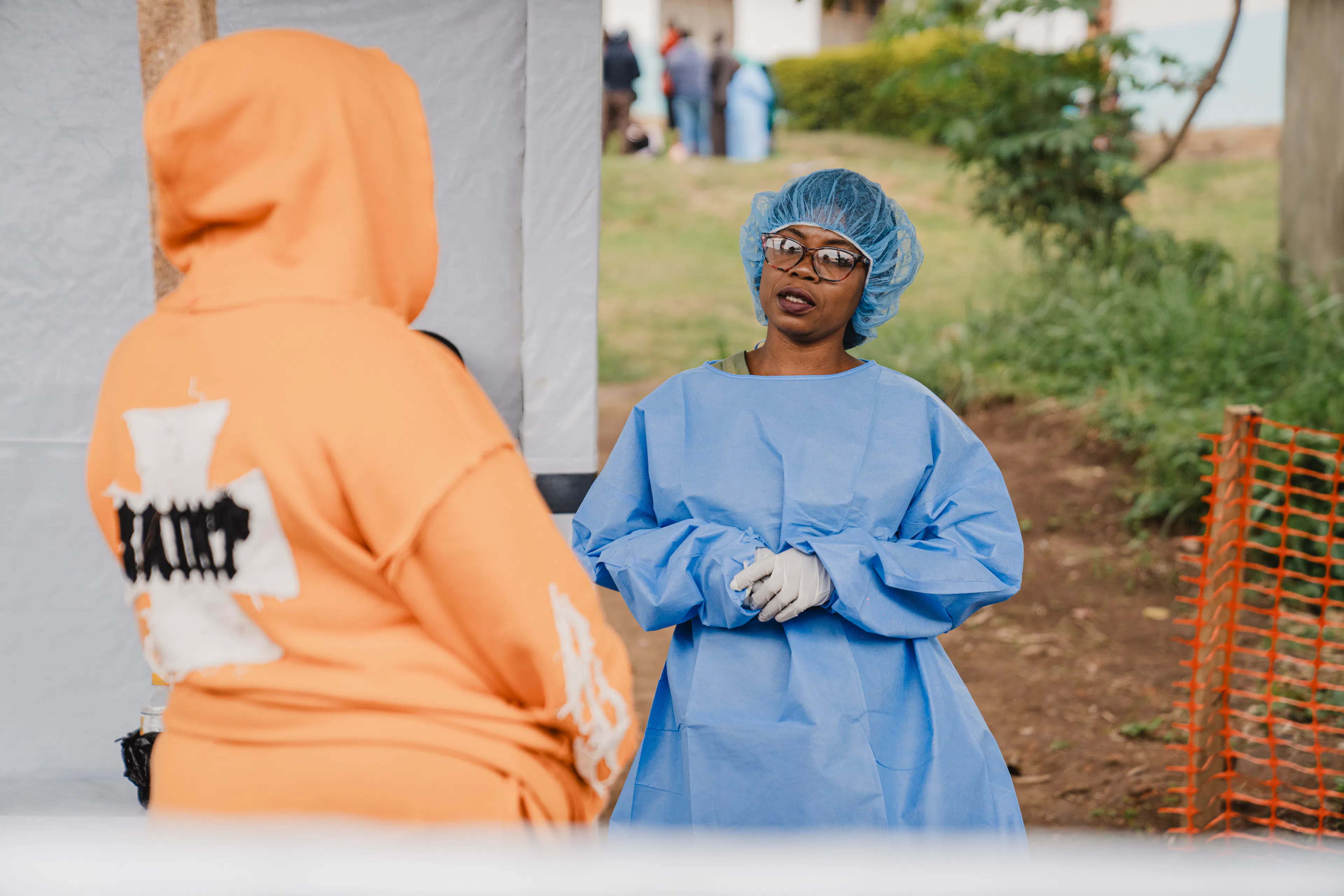 Wivine Kabala speaks with a visitor at the Ebola Treatment Centre in Bunia, Ituri Province.