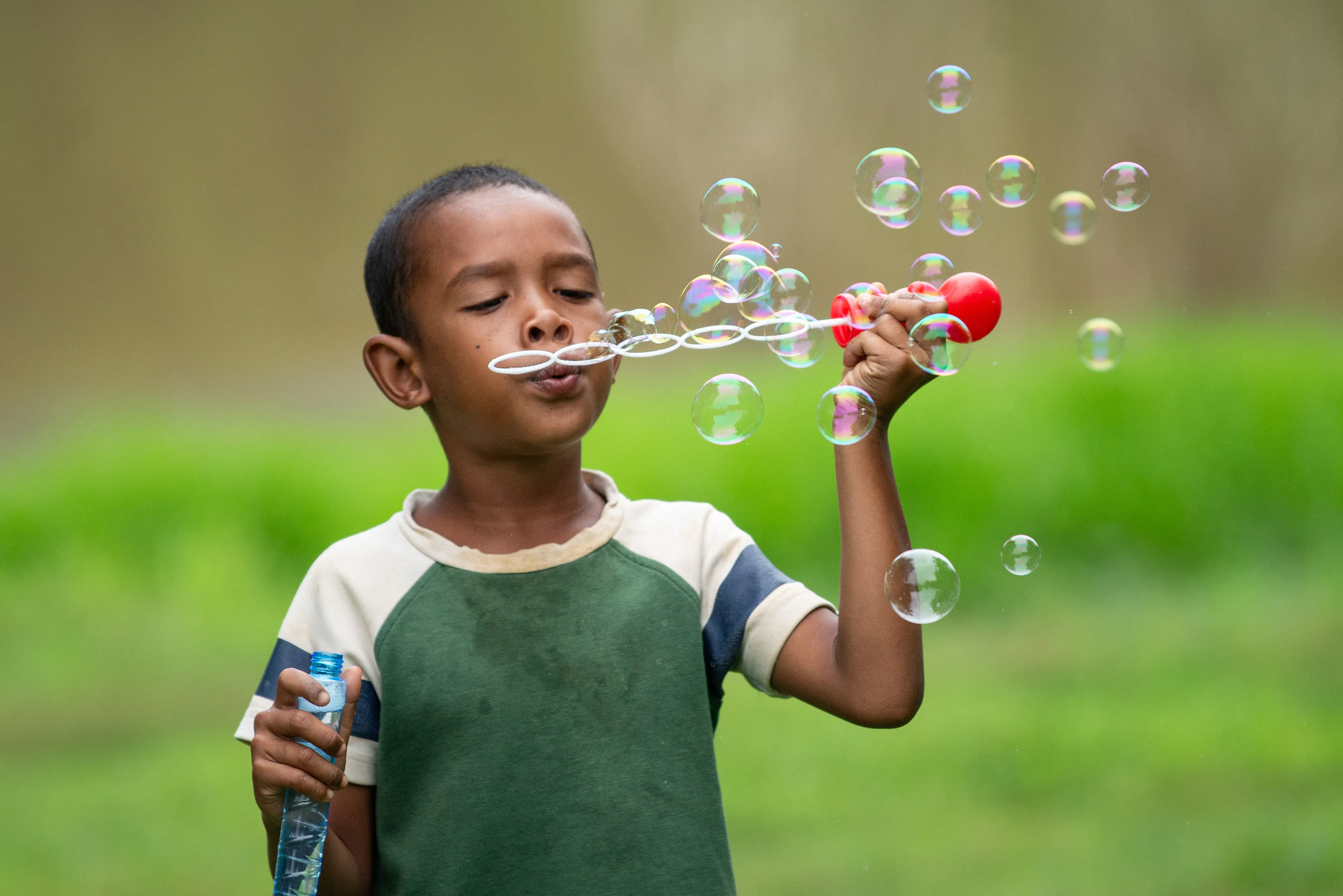 Boy blowing bubbles