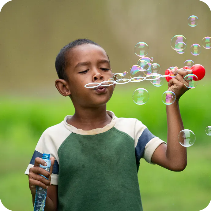 A child blowing bubbles