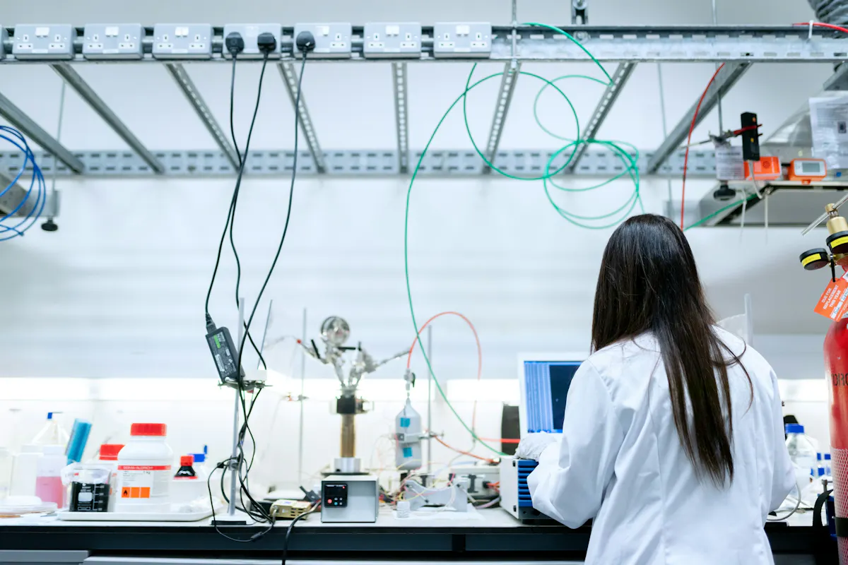 Lab scientist working with a laptop