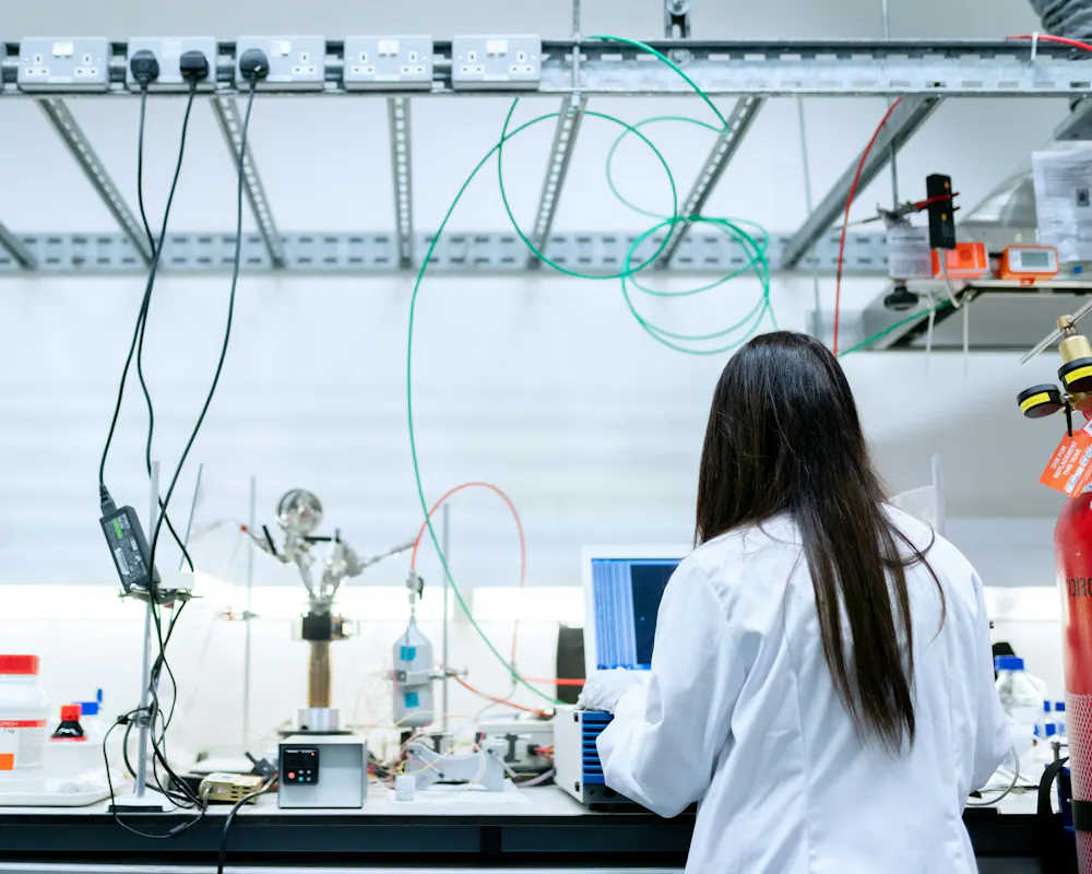 Lab scientist working with a laptop