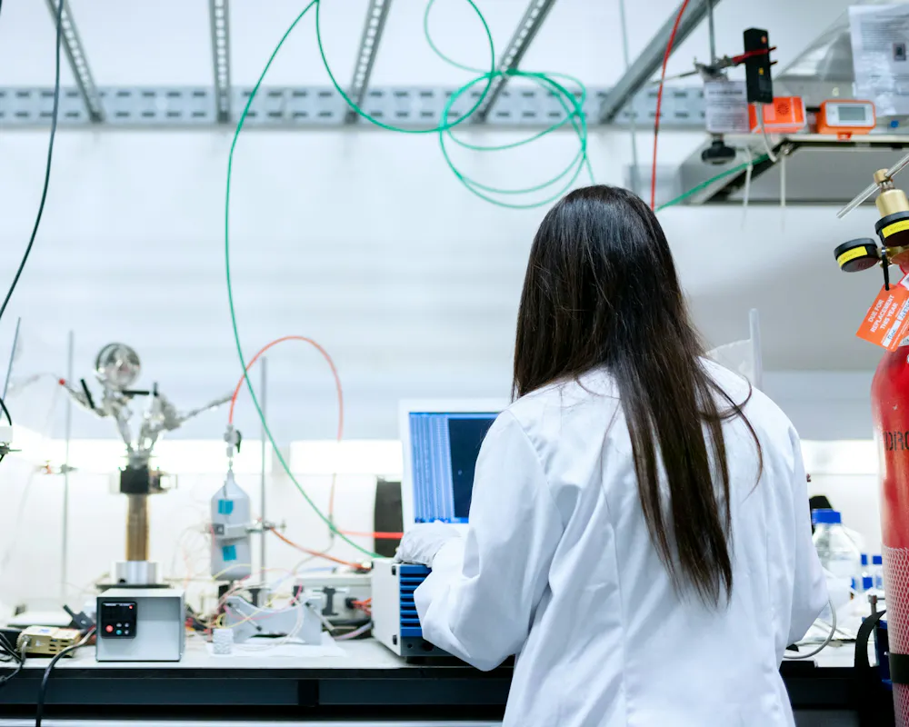 Lab scientist working with a laptop