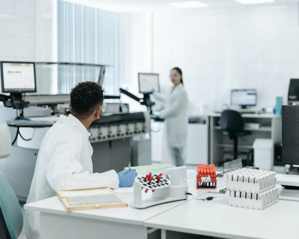 Lab scientists discussing an experiment