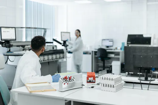 Lab scientists discussing an experiment