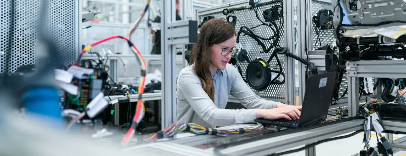 A lab technician working in a highly technical lab environment