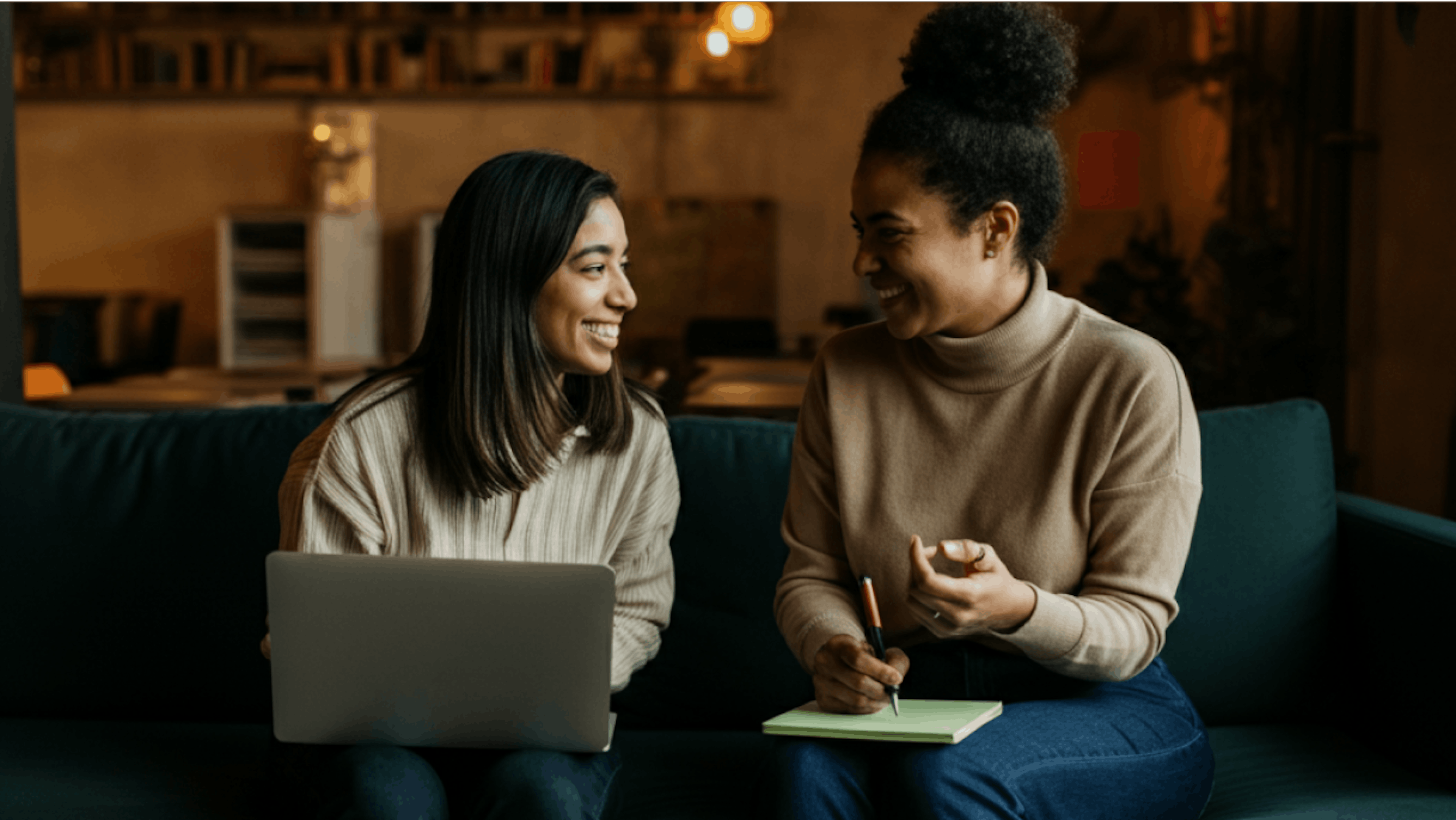 two women chatting at work