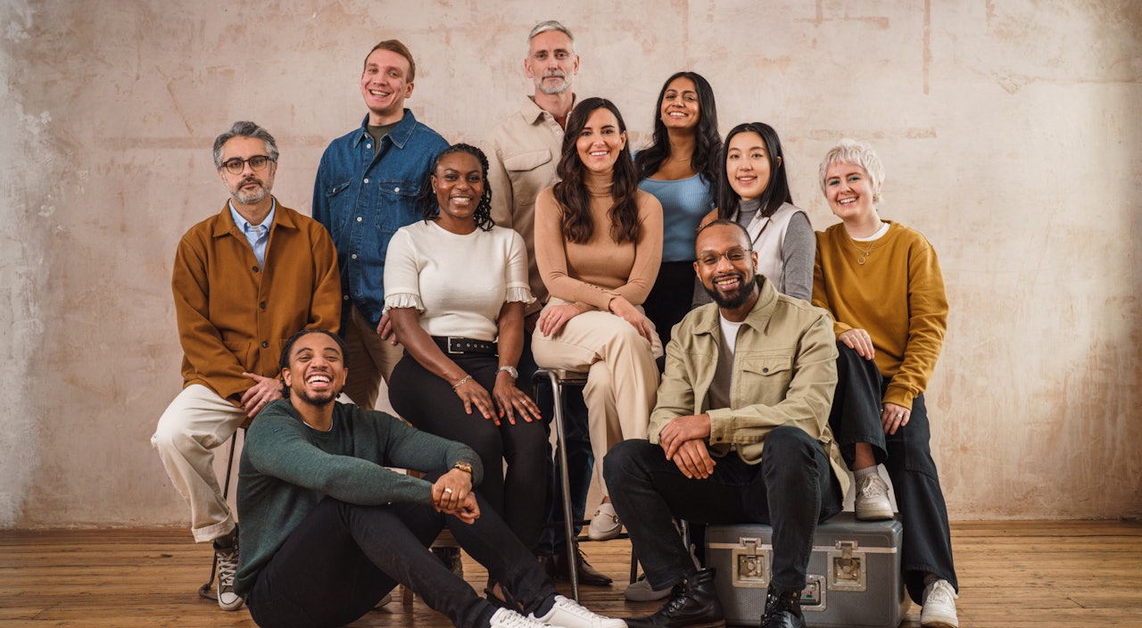 A photo of a diverse group of nine people