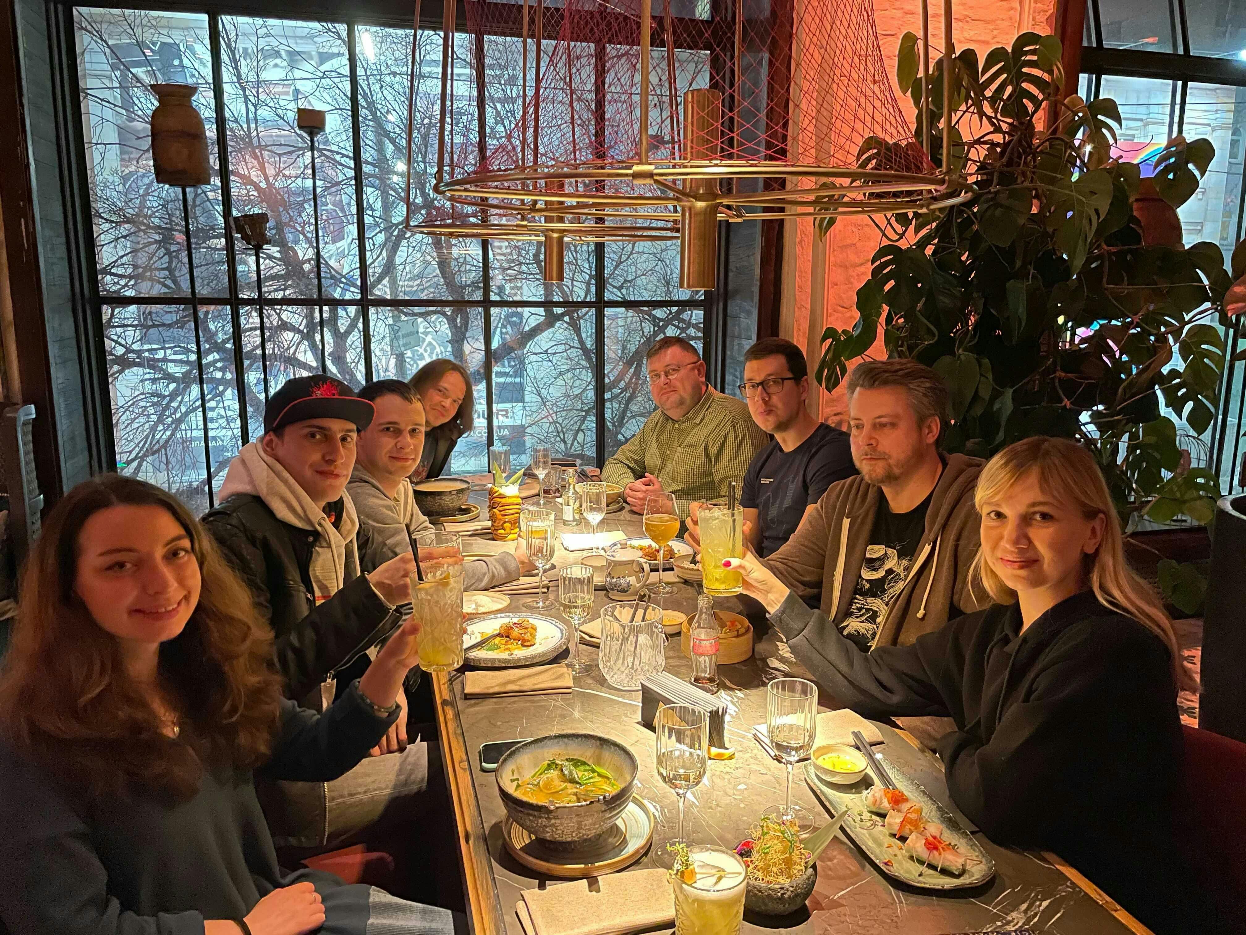 Part of Unstoppable Domains' Ukrainian team gathered around a table for dinner
