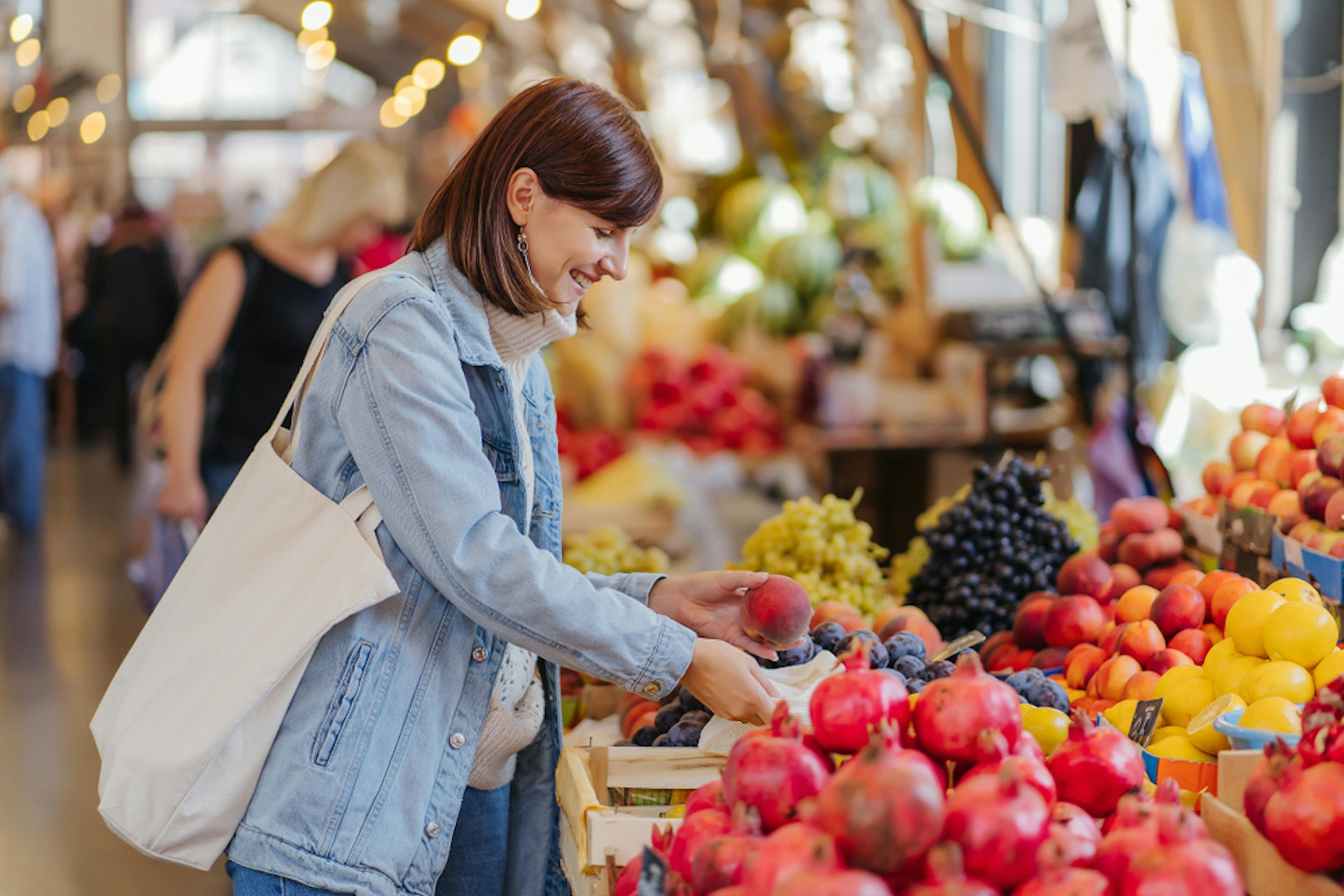 Woman shopping for fruits and vegetables