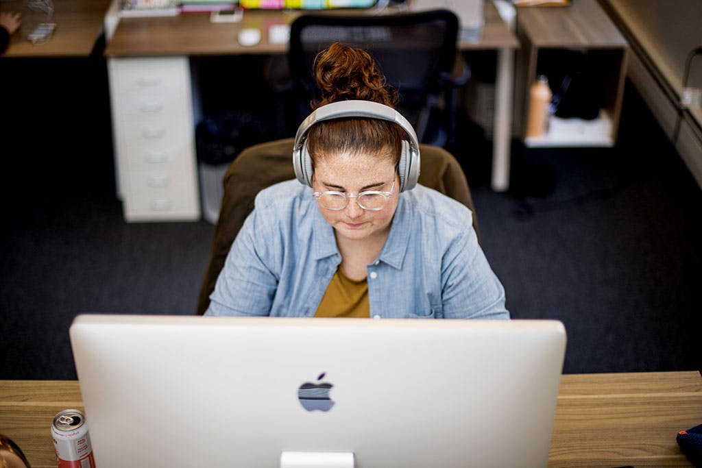 Ali working at her desk