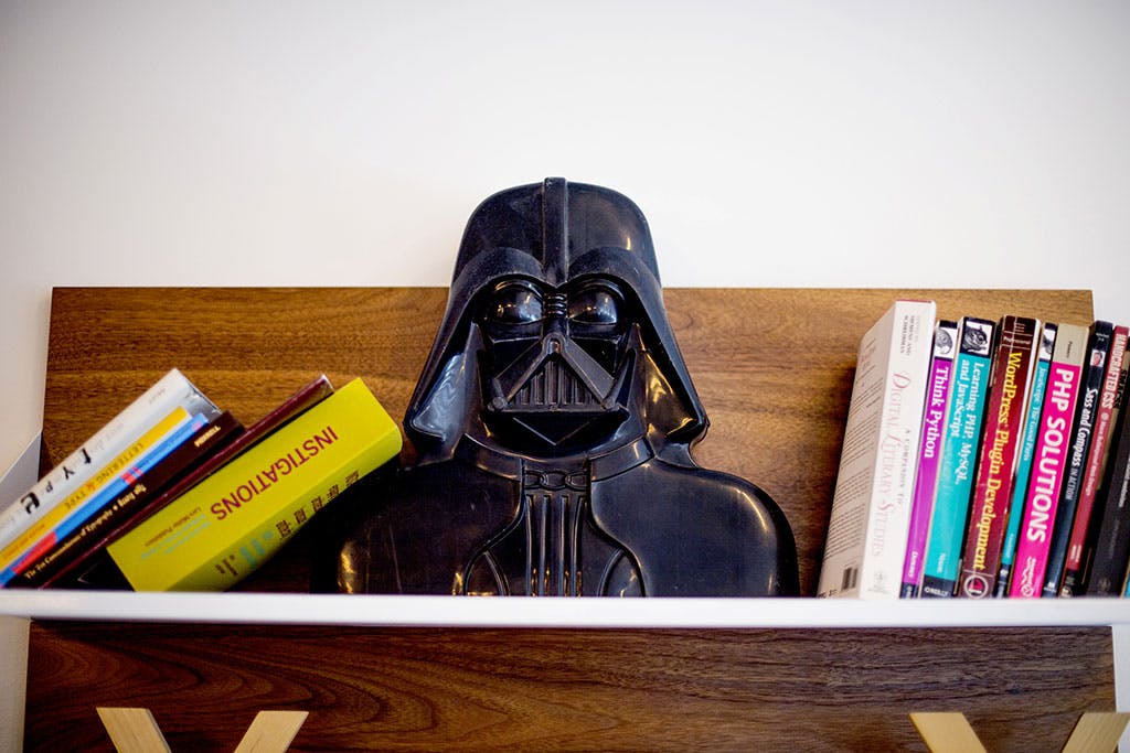 Darth Vader on a bookshelf