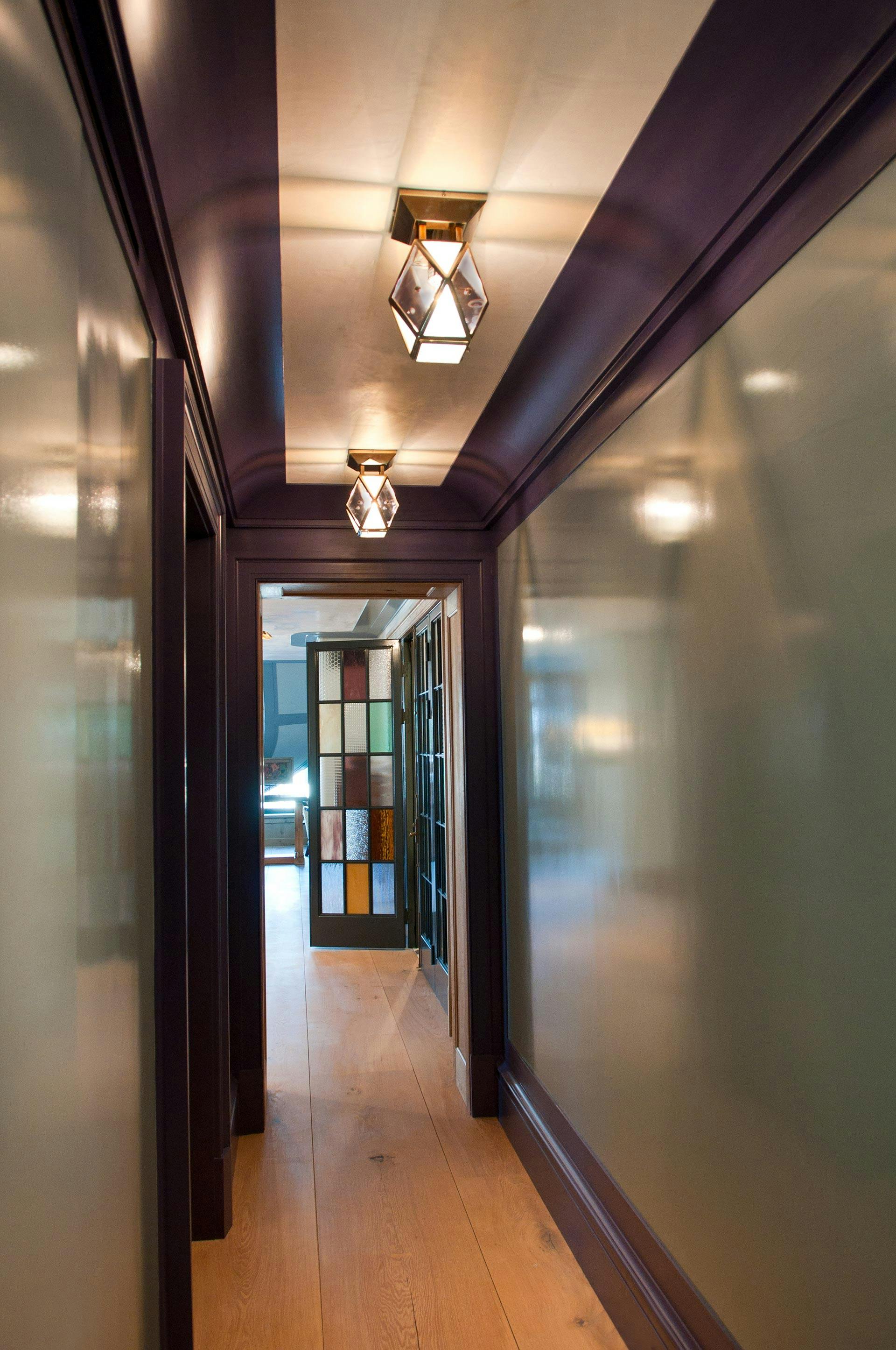 Kardamyli shown in heirloom finish with lavender glass and milk glass accents, customized. Interiors by Steven Gambrel.