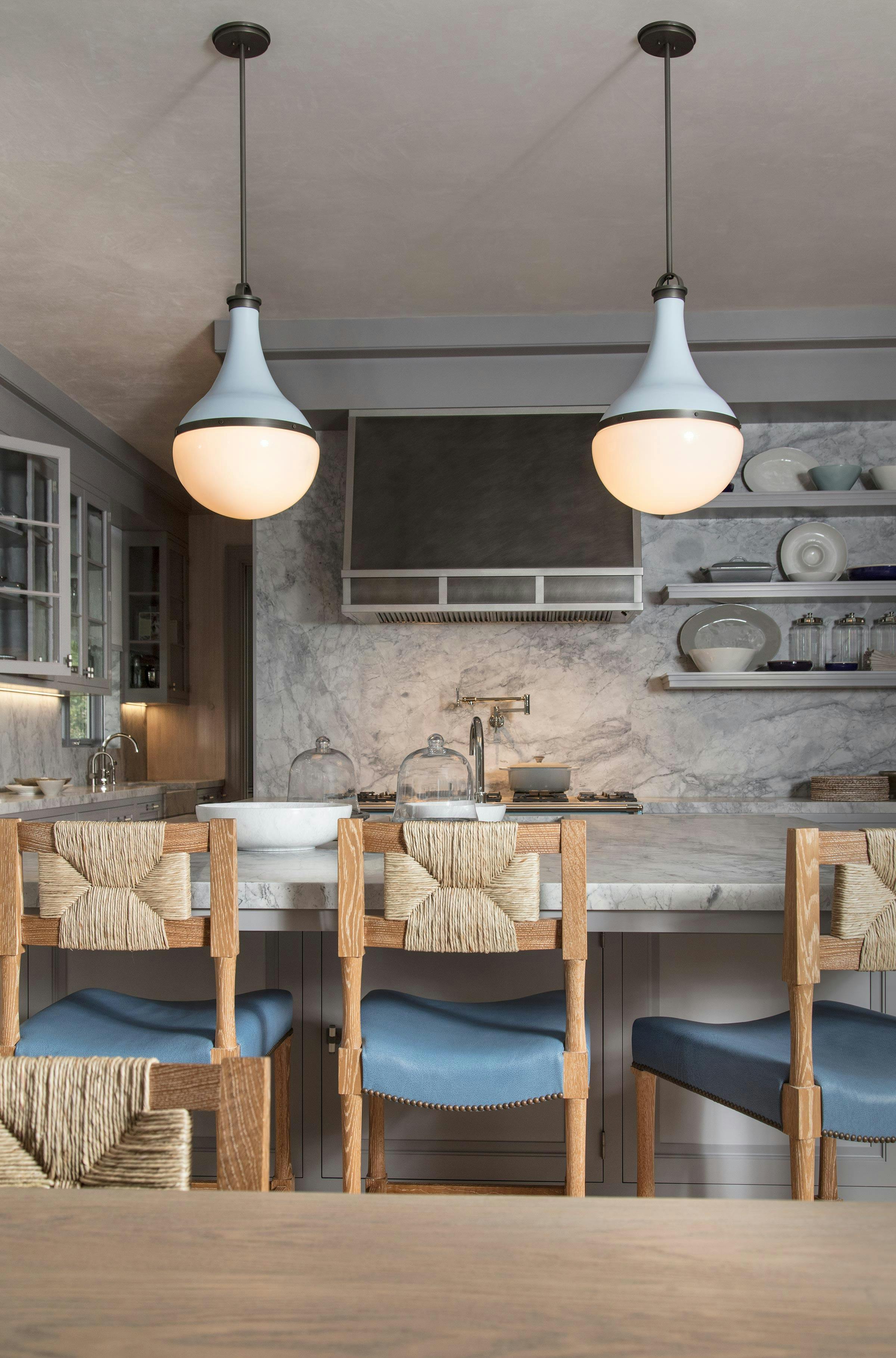 Harford shown in Benjamin Moore #DC-01 Bancroft White paint selection finish with blackened pewter accents and opal glass. Interiors by Steven Gambrel. 
