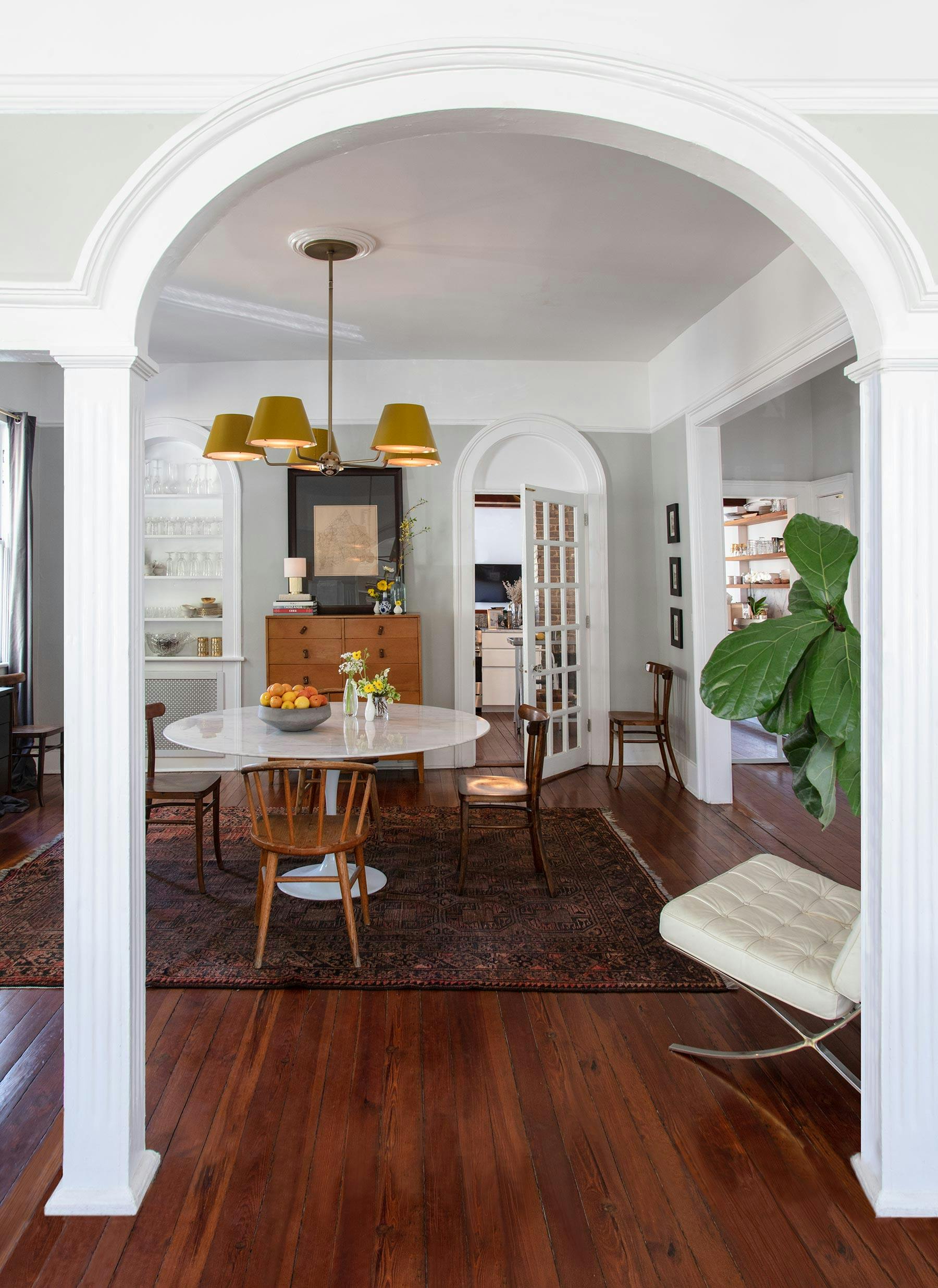 From top: Chiltern Round shown in antique brass finish with heirloom accents. Shades shown in RAL #1027 Curry powder coat finish with hewn brass interior. Rex Table V.2 shown in hewn brass finish with hewn brass accents and shade SH-151X-WHT-LIN. Interiors by Mary Mac Wilson.