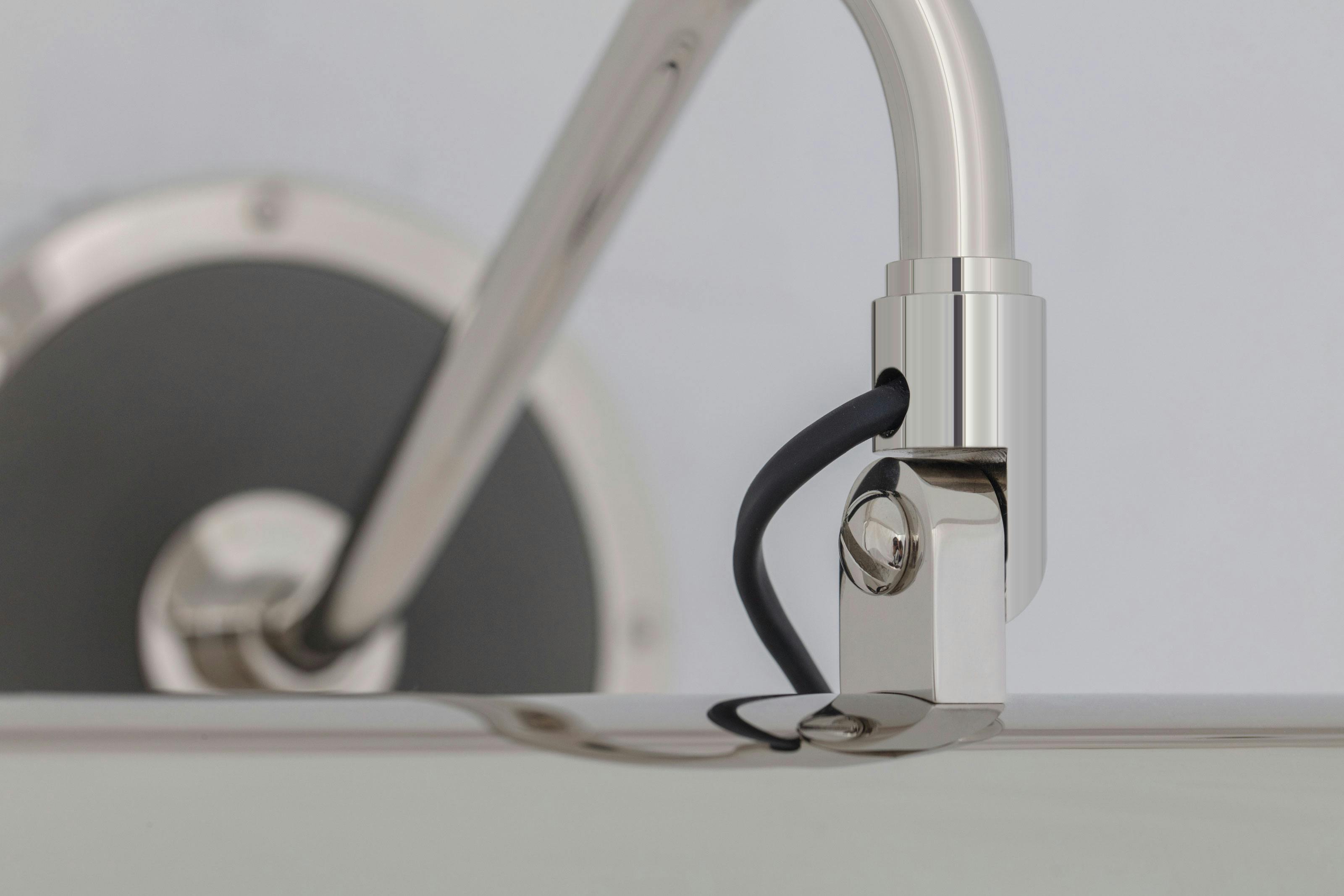 Topper shown in polished nickel finish with blackened pewter accents.