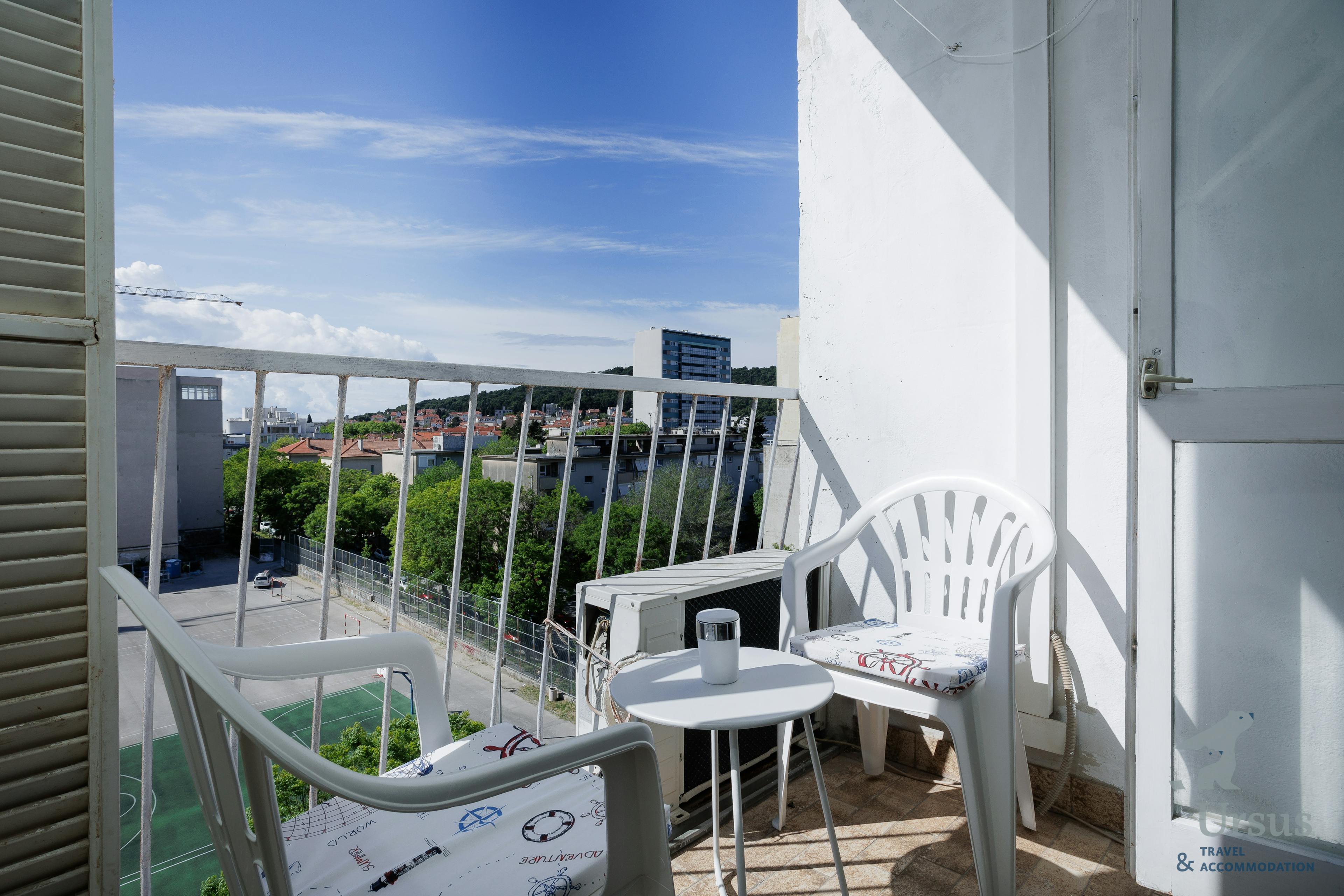 Large balcony overlooking children's playground and Marjan hill