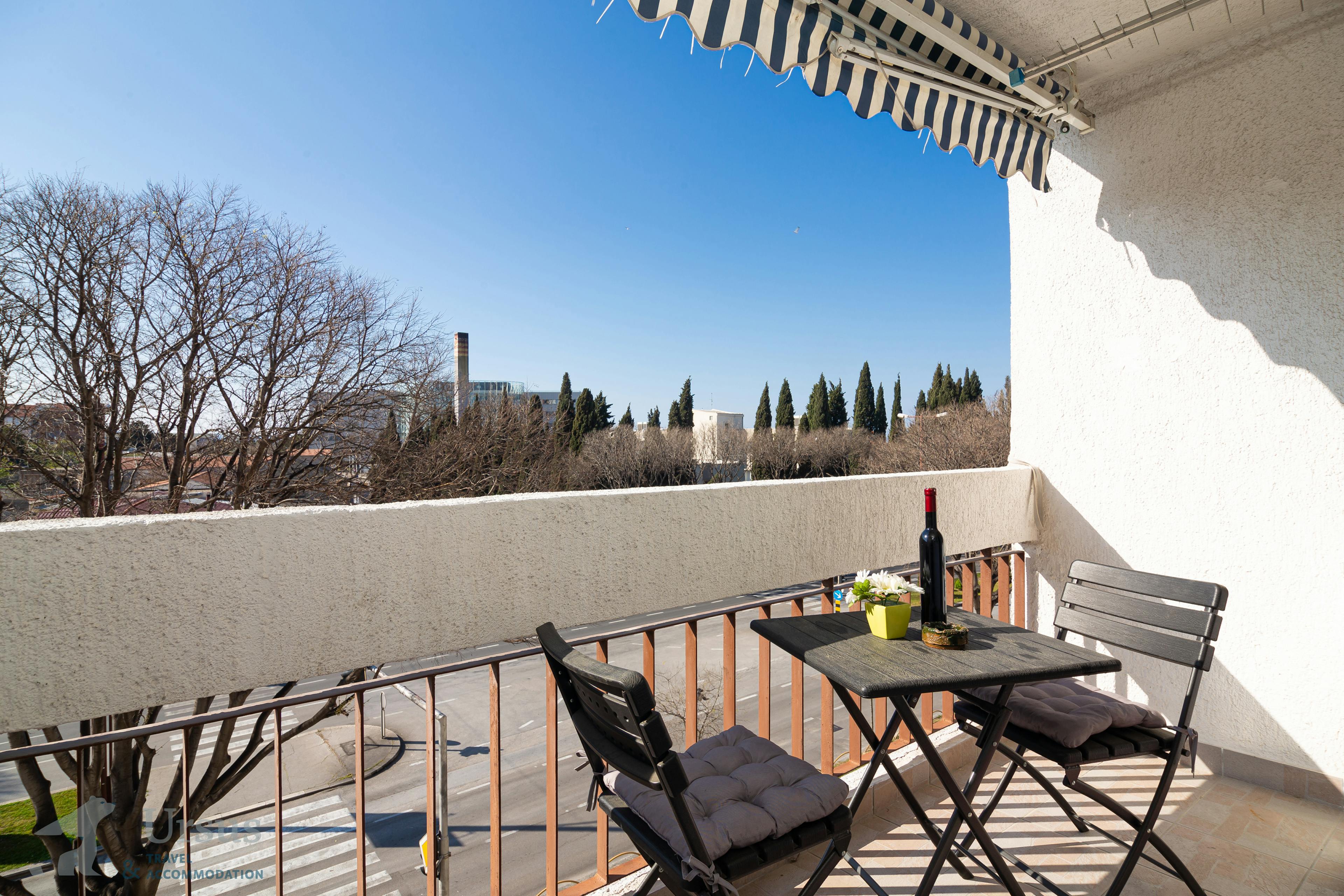 Lovely balcony with outdoor furniture