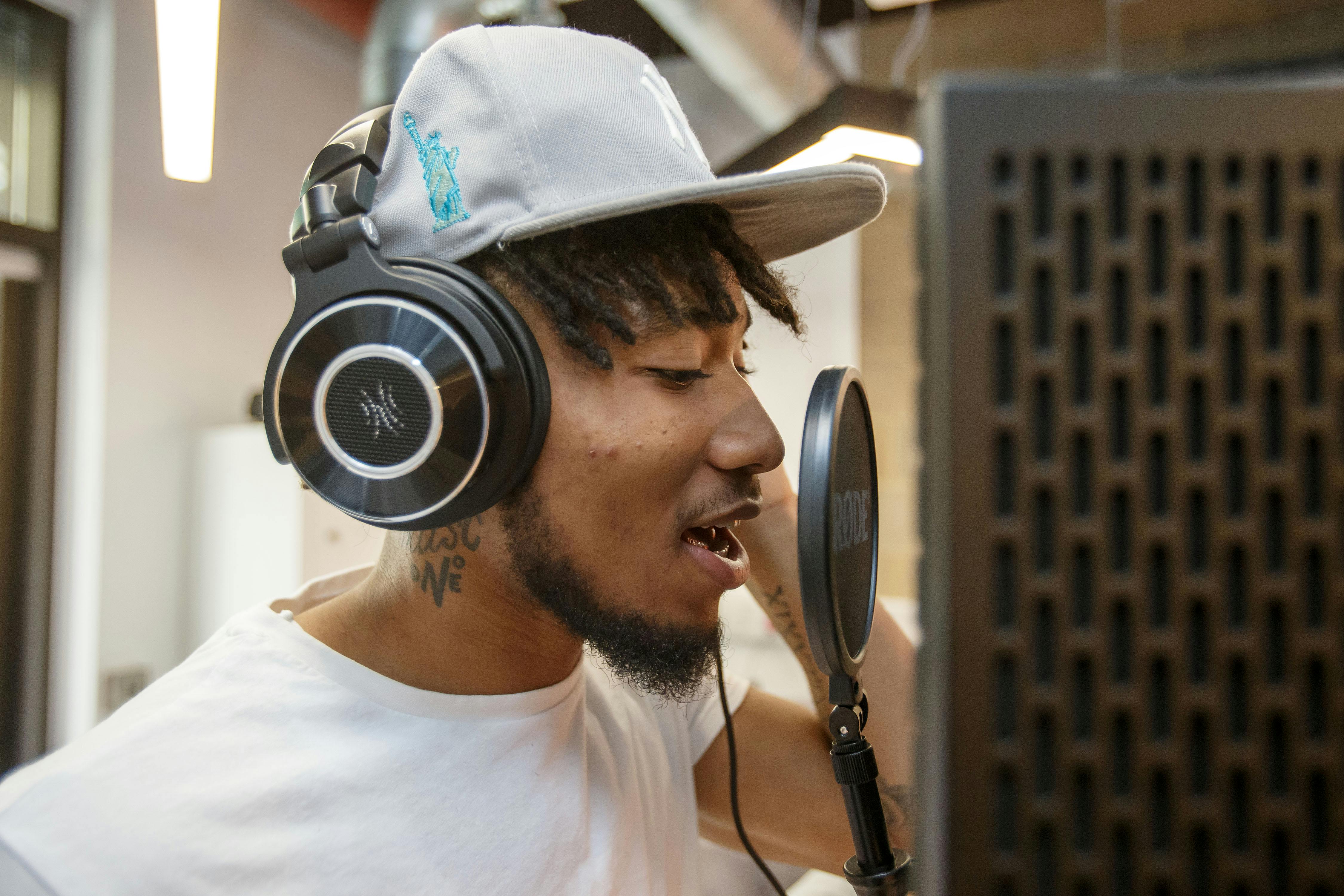 A young man singing into a microphone