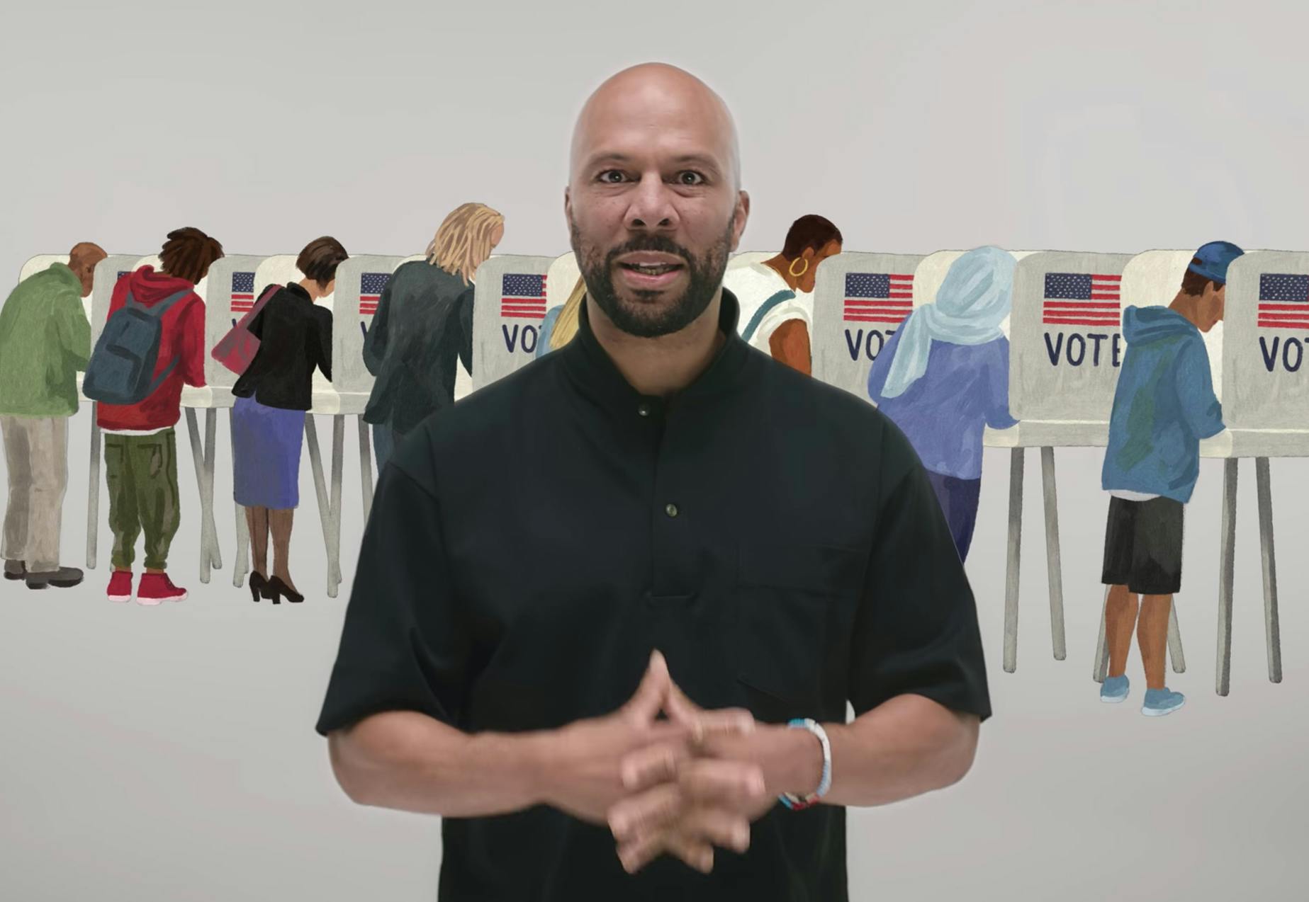 A man standing in front of voters and voting booths