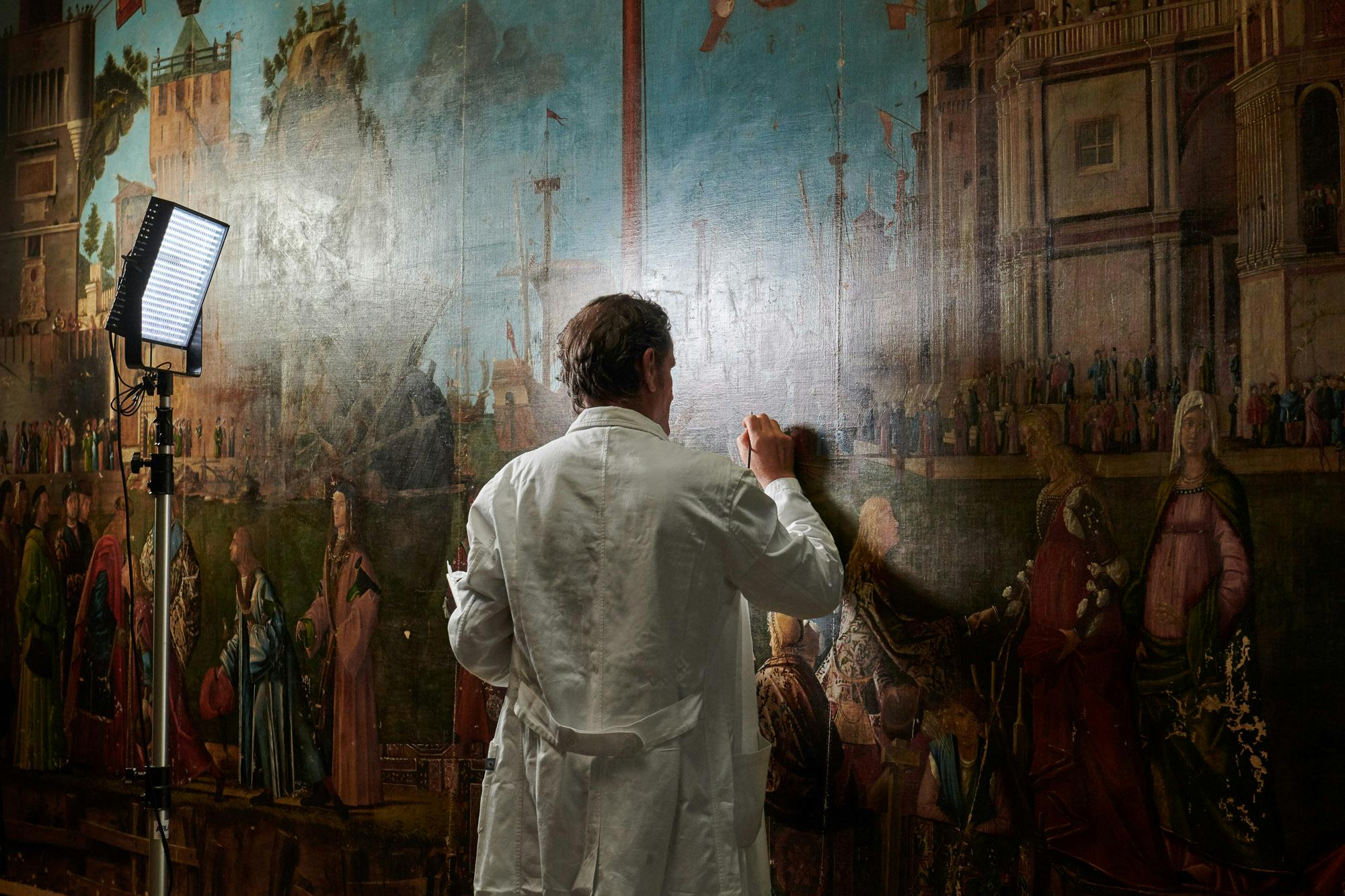 A man painting a mural