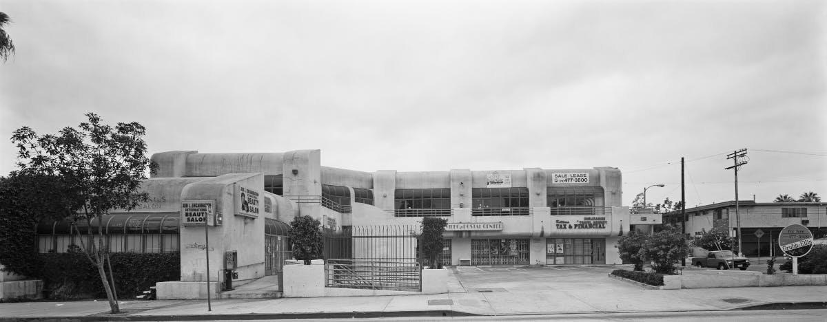 A strip mall in black and white