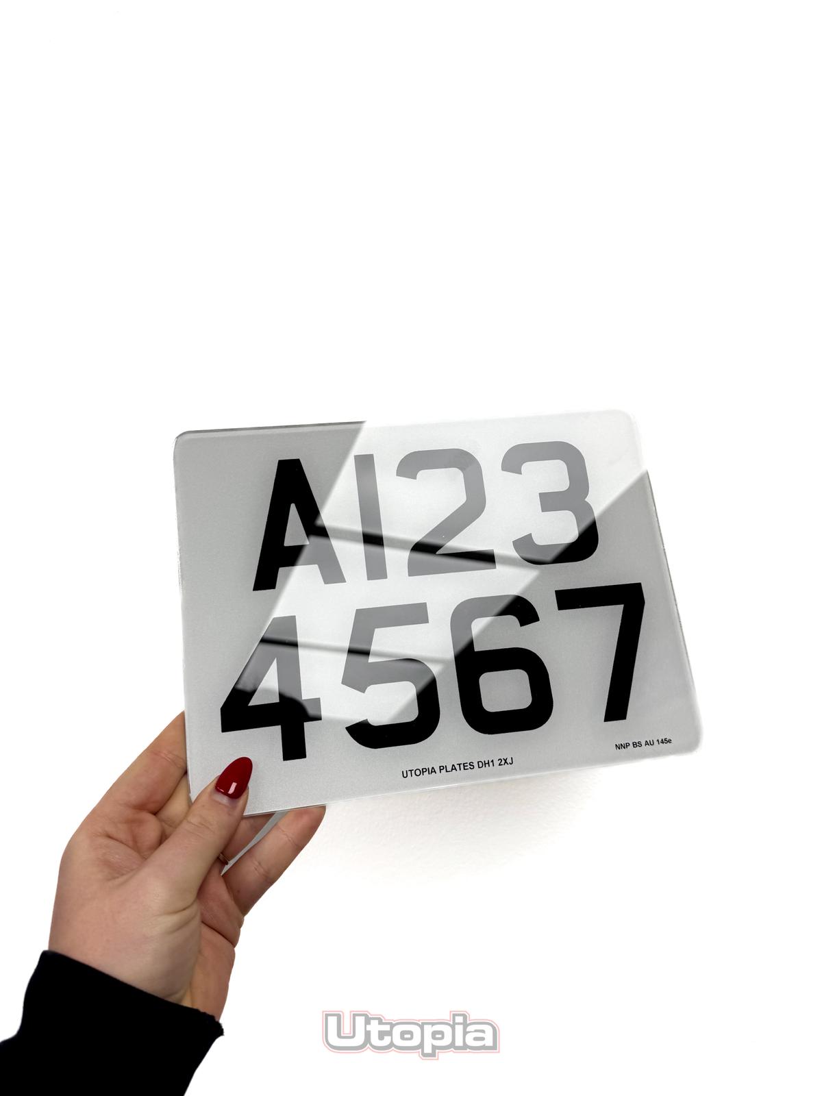 A white reflective UK trailer number plate for travelling abroad