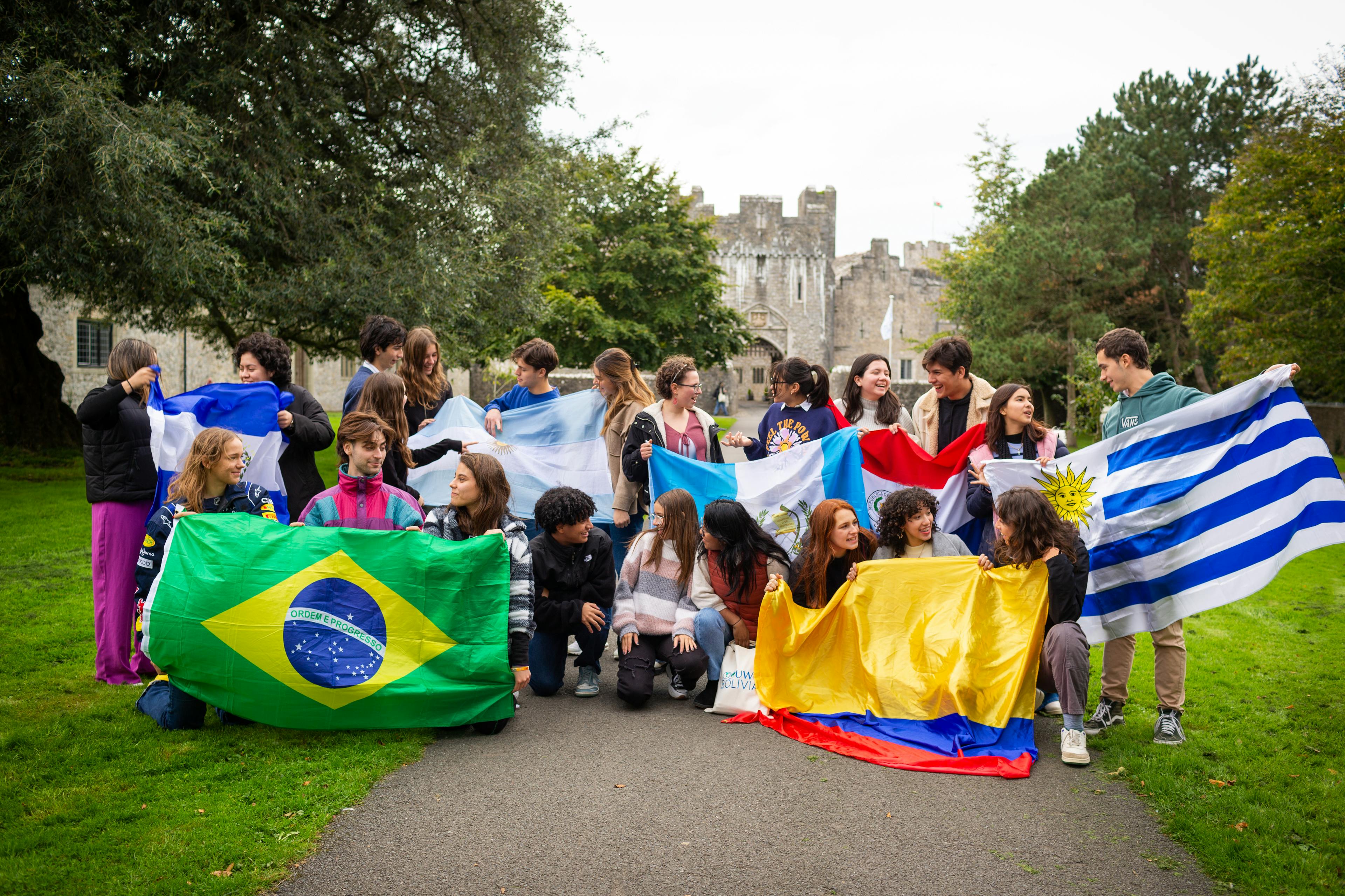 students displaying their flags from all over the world