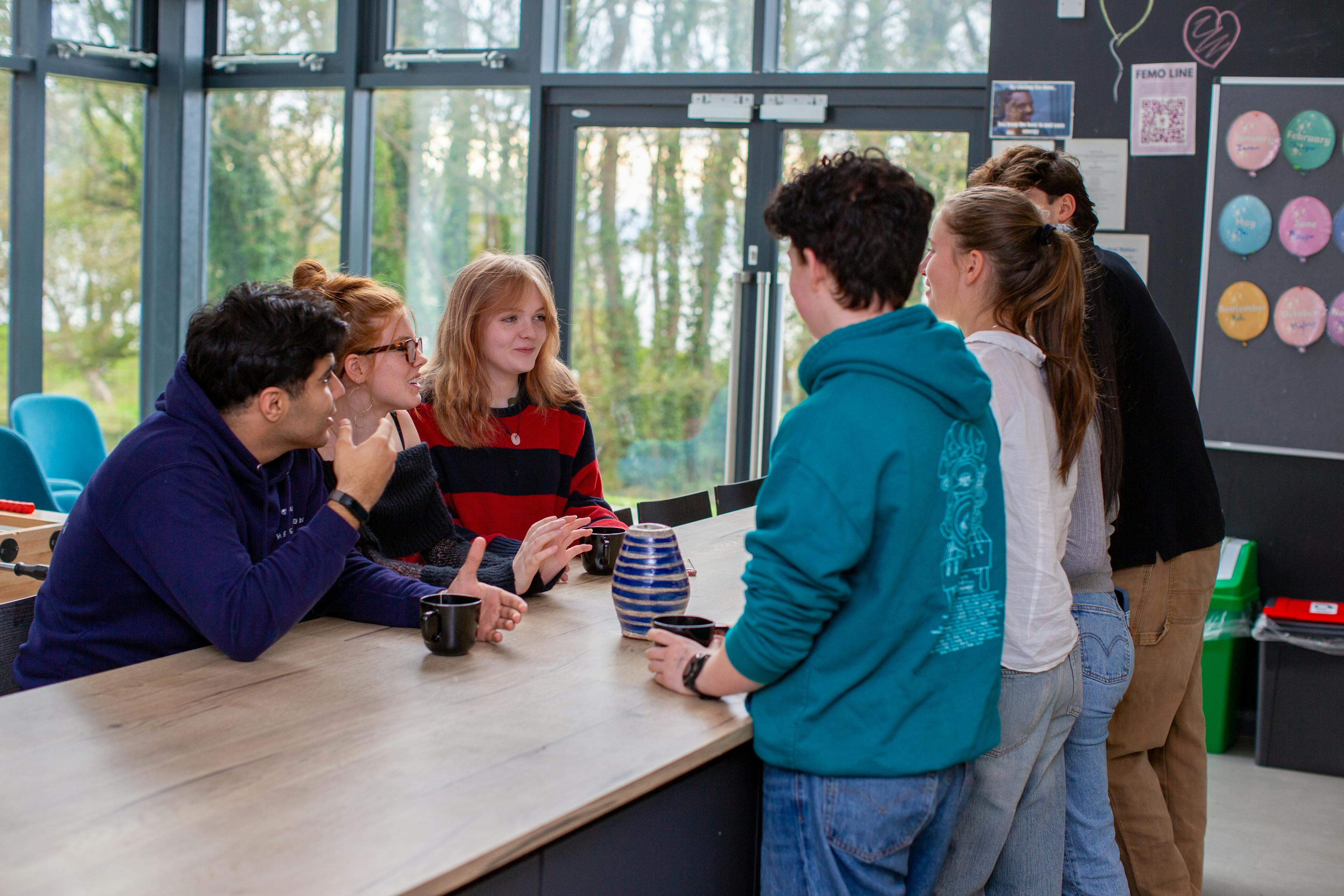 students chatting in a uwc atlantic college dorm