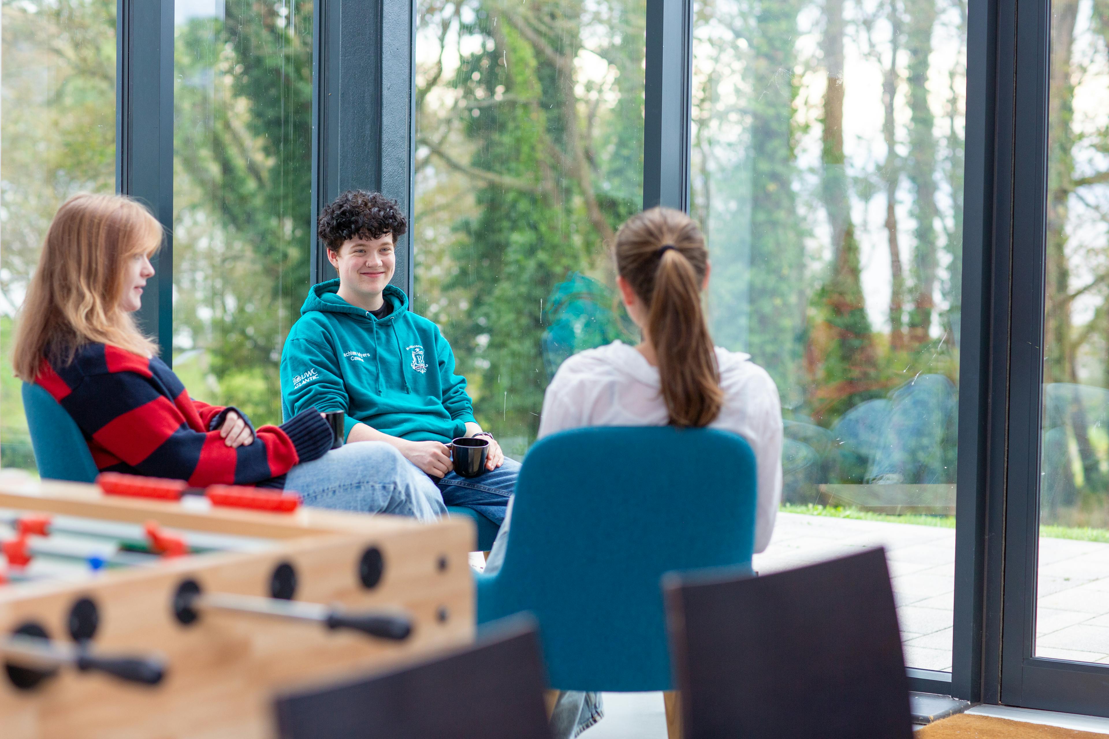 students chatting in a uwc atlantic college dorm