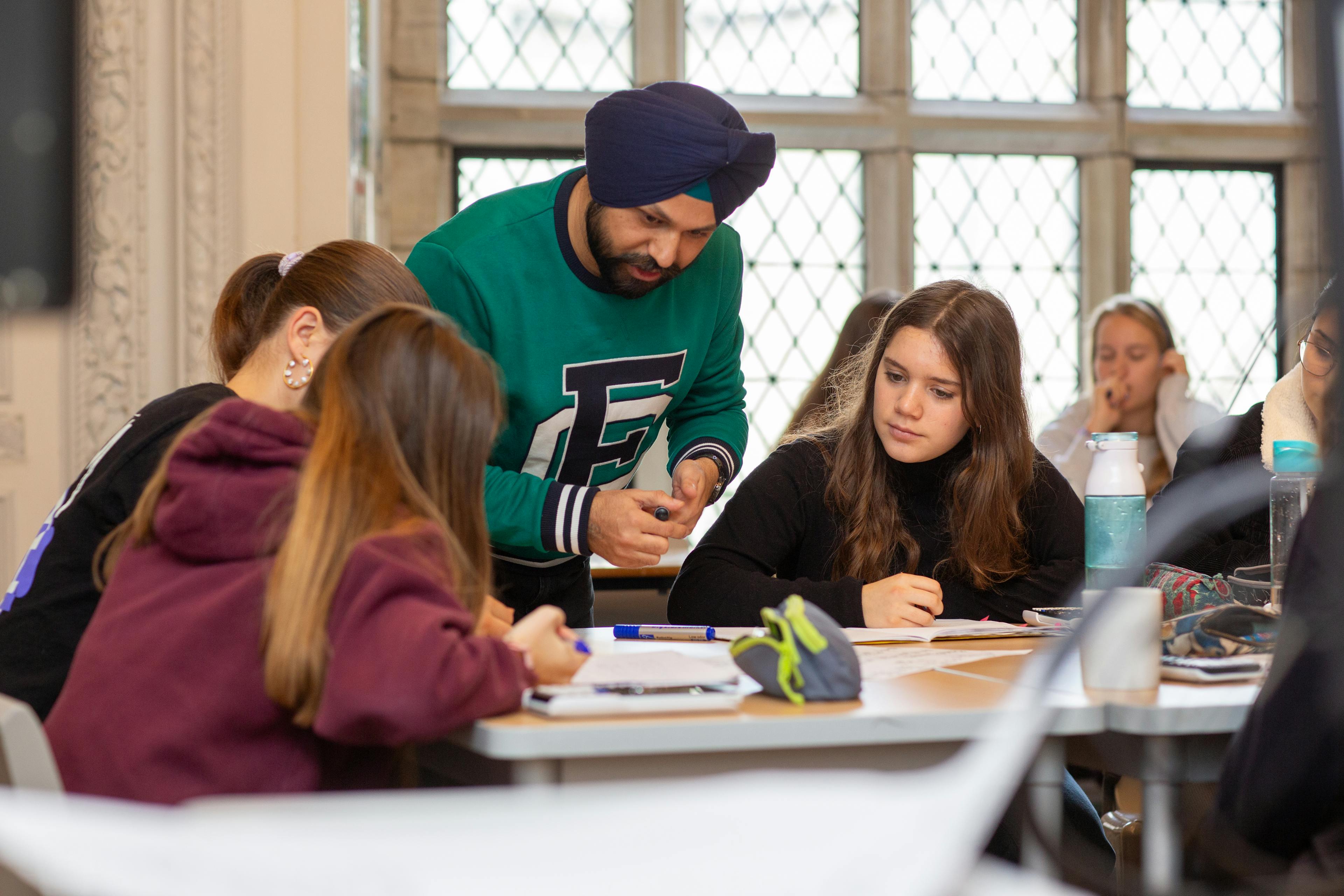 Teacher and students studying the IB at UWC Atlantic