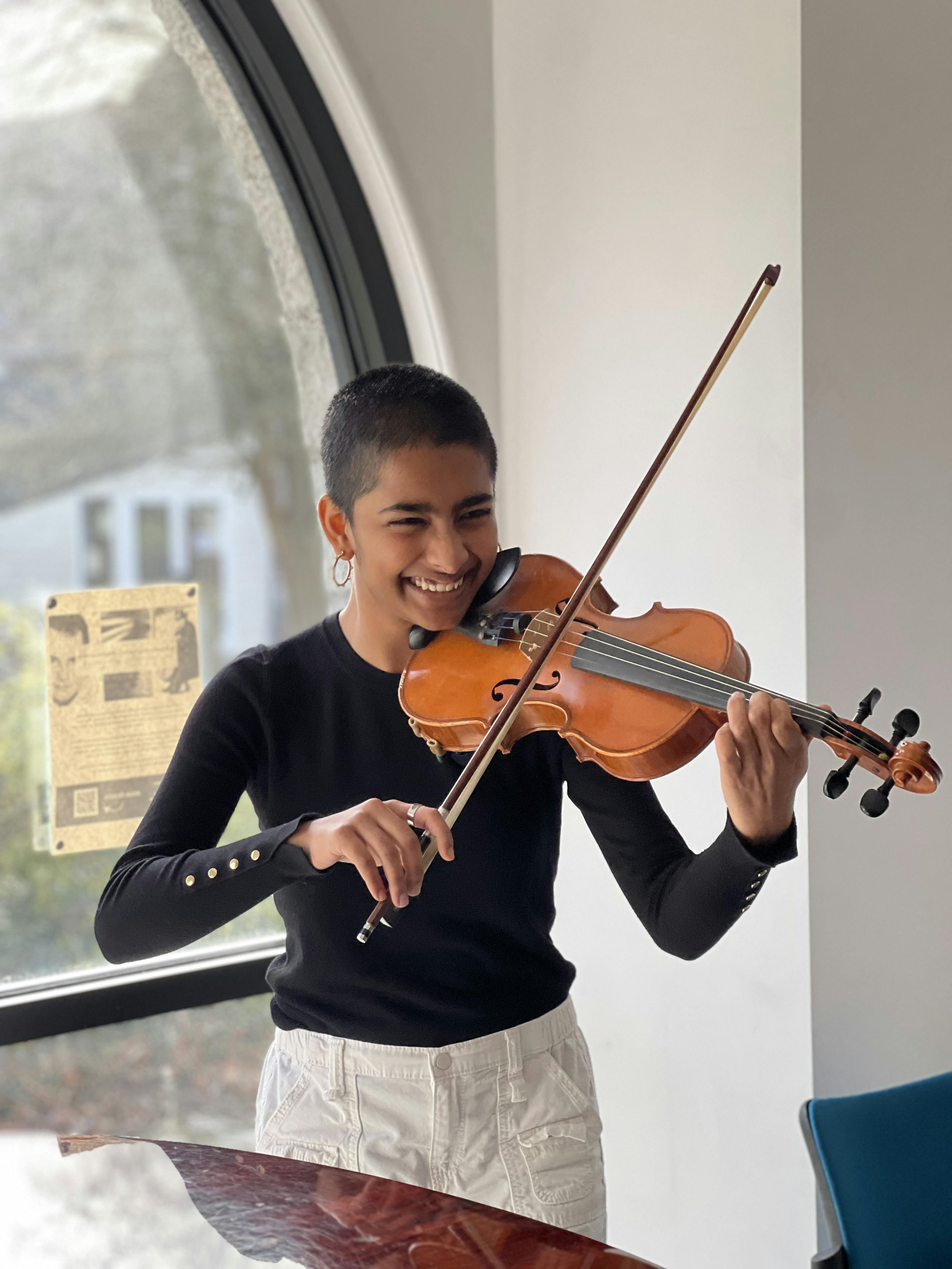 Cayla UWC Atlantic student plays the violin