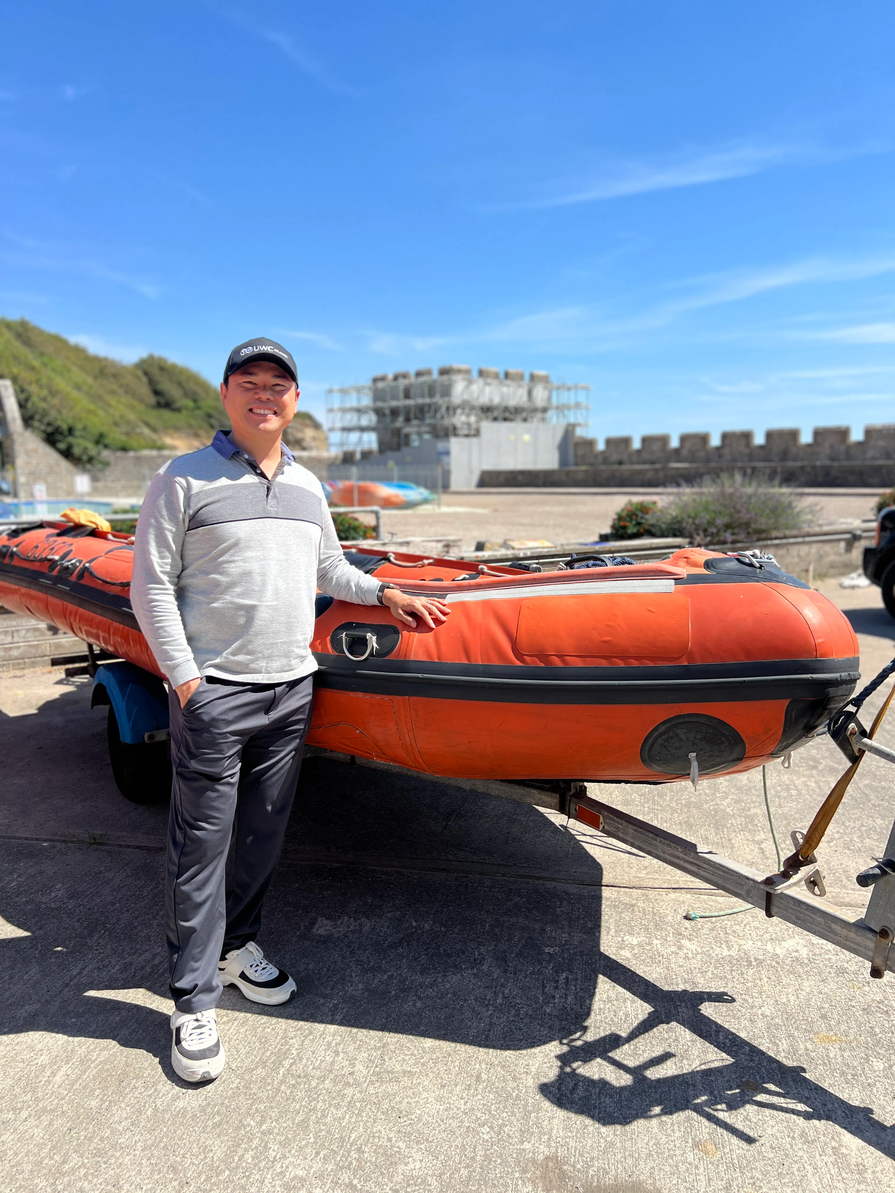 Albert Hui UWC Atlantic Alumnus from 1997 with a RIB boat