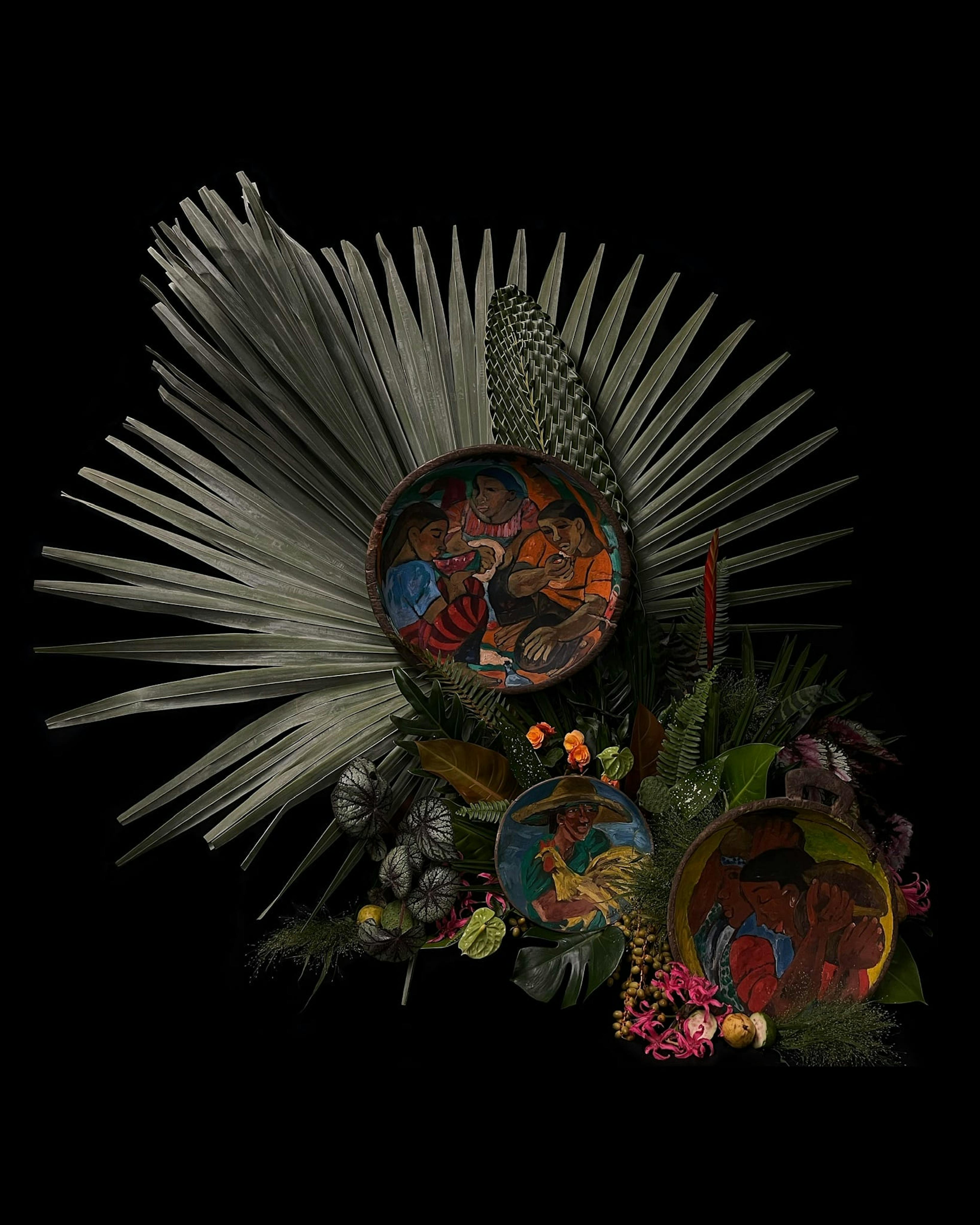 Arrangement of large palm with ferns and Filipino painted bowls on a black background.