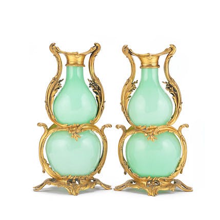 A pair of mid 19th century French gilt bronze mounted and celadon green opaline glass vases