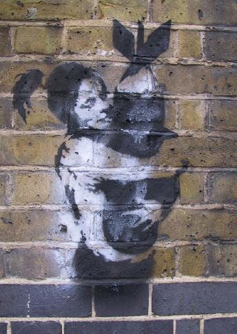 A photo of Banksy's street art in Bristol's underground scene. (Public Domain)