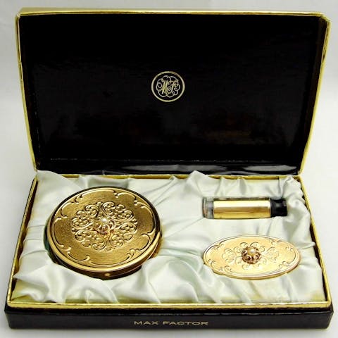 Vintage Maxfactor compact set with a lipstick and a lipstick case, compact powder, and a presentation box from the 1960s