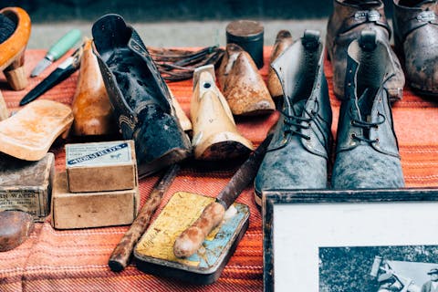 assortment of vintage shoes and shoe making supplies
