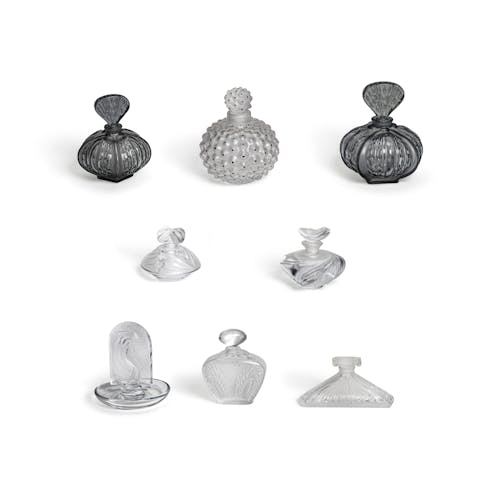 A group of Lalique glass perfume bottles and accessorie