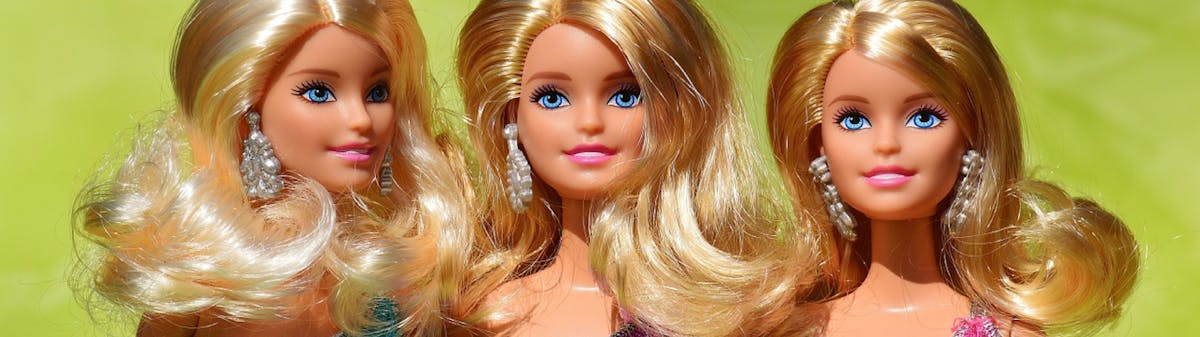 three Barbie dolls