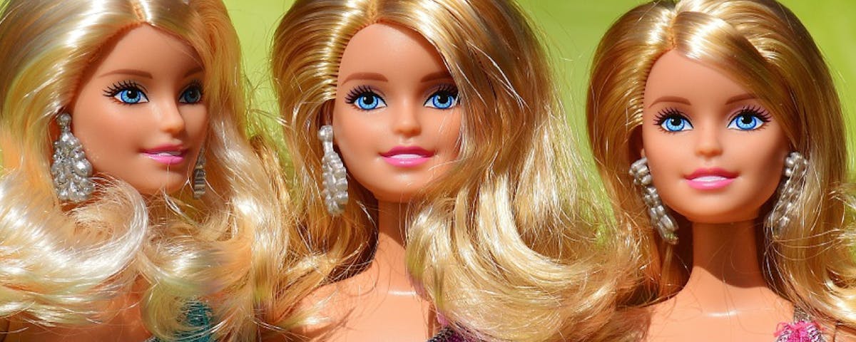 three Barbie dolls