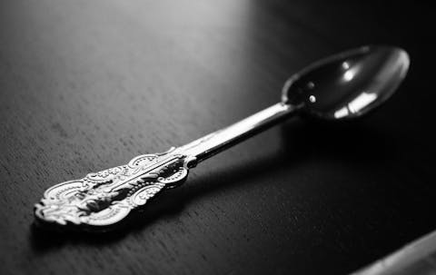 details of decorative silver spoon