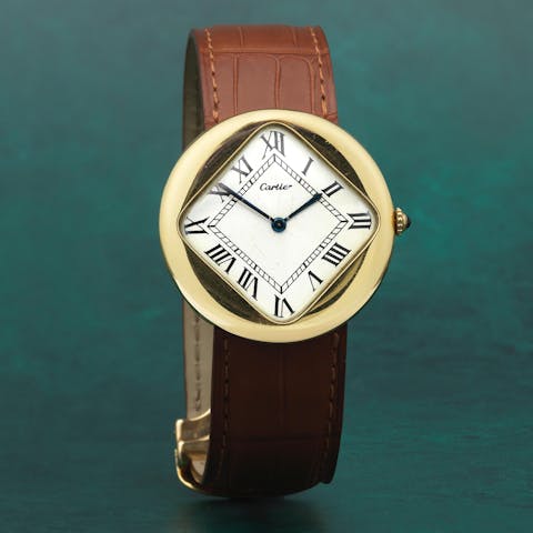Cartier. A very fine and rare 18K gold manual wind wristwatch, model: pebble, from 1972, sold for £239,700  in Bonhams, London in December 2022