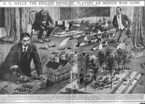 H. G. Wells playing a war game with W. Britain toy soldiers according to the rules of "Little Wars"