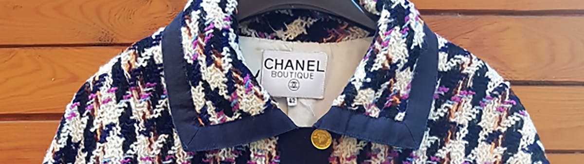 navy and cream Chanel tweed jacket