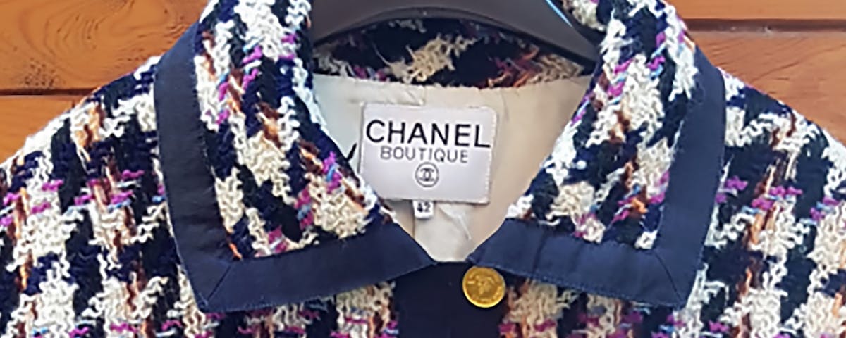 navy and cream Chanel tweed jacket