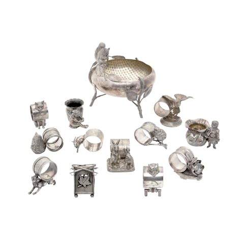  American silver-plated figural napkin holders.