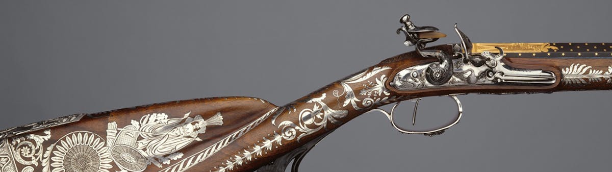 vintage sporting gun with inlaid silver